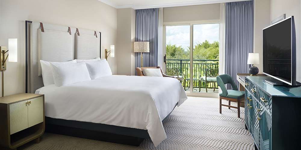 Omni Orlando Resort at ChampionsGate hotel guest rooms and suite bedroom custom furniture and casegoods