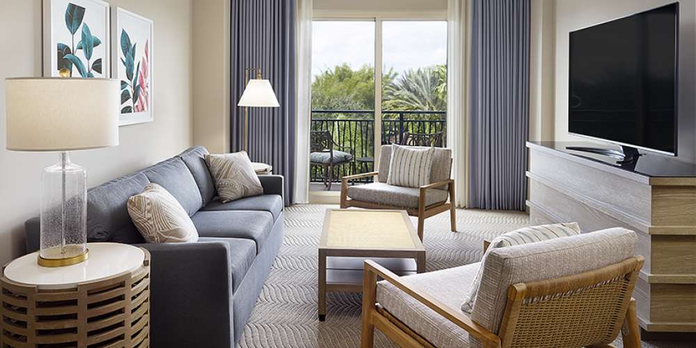 Omni Orlando Resort at ChampionsGate hotel guest rooms and suite bedroom custom furniture and casegoods