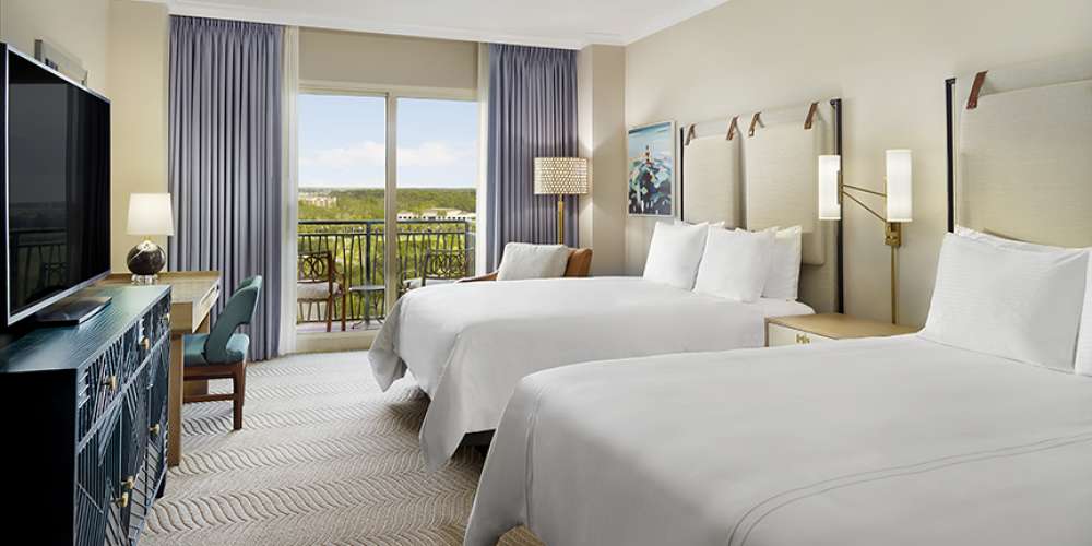 Omni Orlando Resort at ChampionsGate hotel guest rooms and suite bedroom custom furniture and casegoods