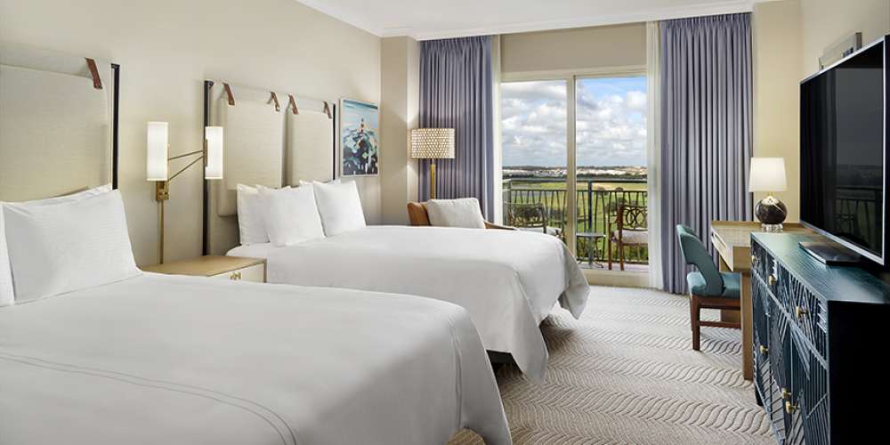 Omni Orlando Resort at ChampionsGate hotel guest rooms and suite bedroom custom furniture and casegoods