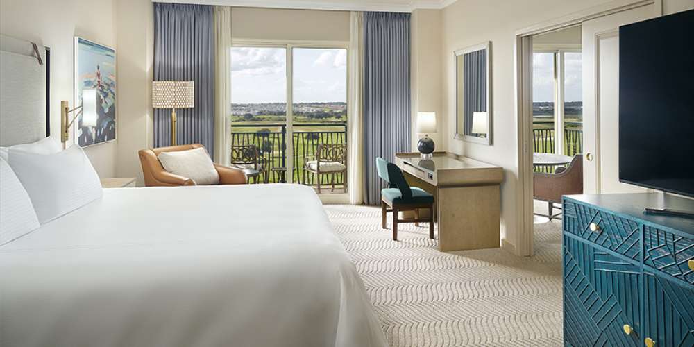 Omni Orlando Resort at ChampionsGate hotel guest rooms and suite bedroom custom furniture and casegoods