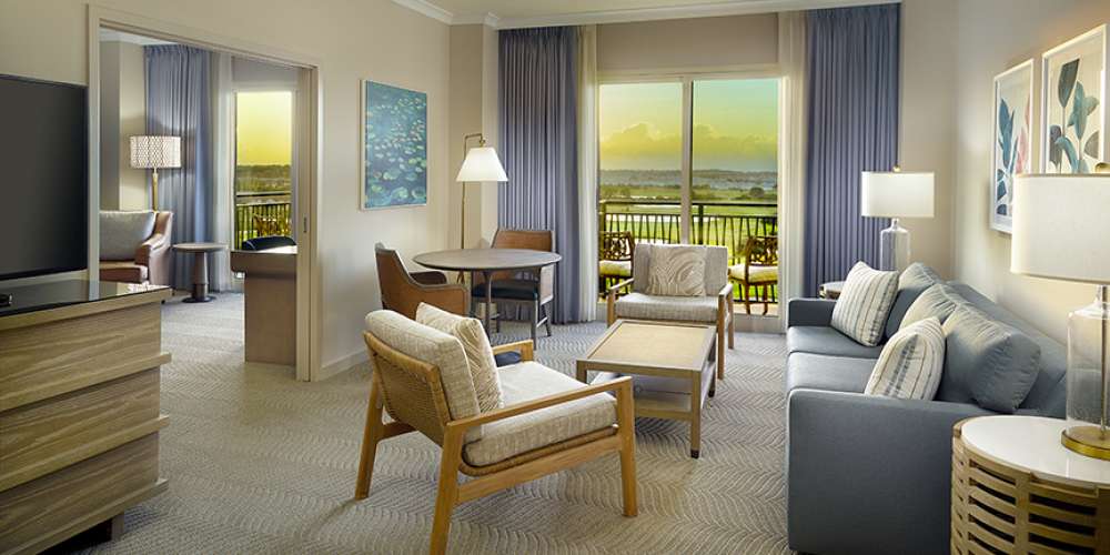 Omni Orlando Resort at ChampionsGate hotel guest rooms and suite bedroom custom furniture and casegoods