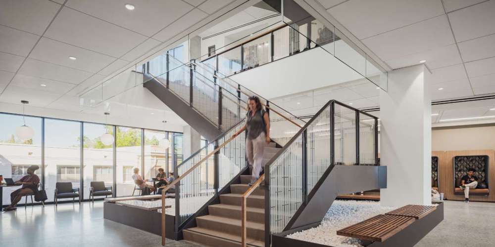 Stairs going upstairs from a study area in a university to another area