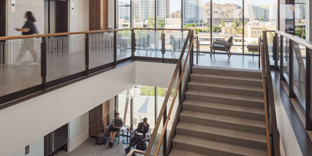 Stairs coming up from one study area to another in a university setting