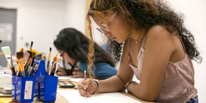 Fresh Artists studio with student creating art