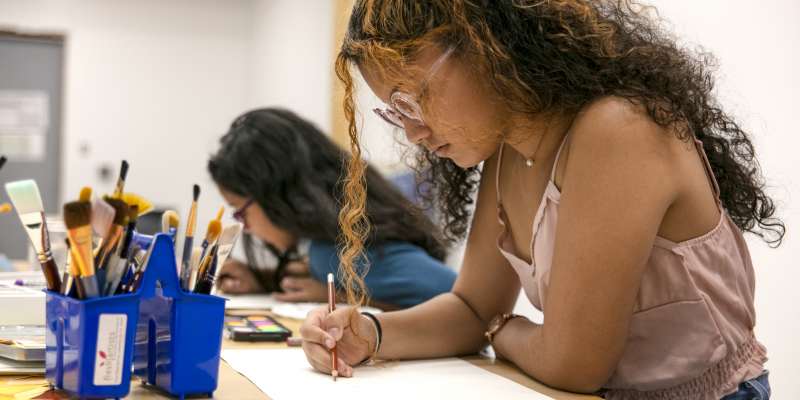 Fresh Artists studio with student creating art