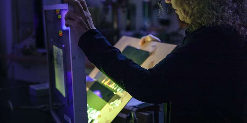 Lyn Godley in studio creating art