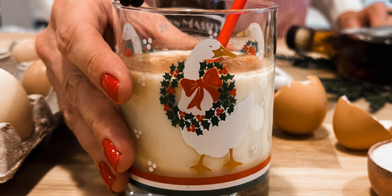 Hospitality Manager holding holiday drink