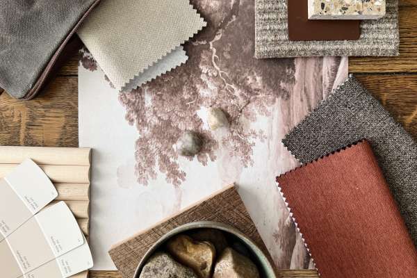 Flatlay arrangement featuring Eton textiles with complementary fabrics, paint swatches, terrazzo, wood, and natural stone elements in earthy reds, browns, and neutrals.Flatlay arrangement featuring Eton textiles with complementary fabrics, paint swatches, terrazzo, wood, and natural stone elements in earthy reds, browns, and neutrals.