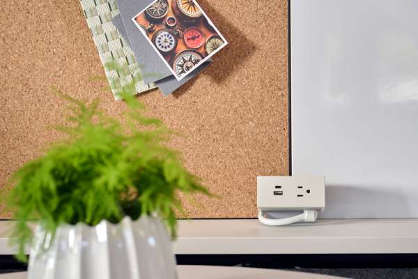 Kaleid workstation with integrated power module and cork board for flexible, connected work environments