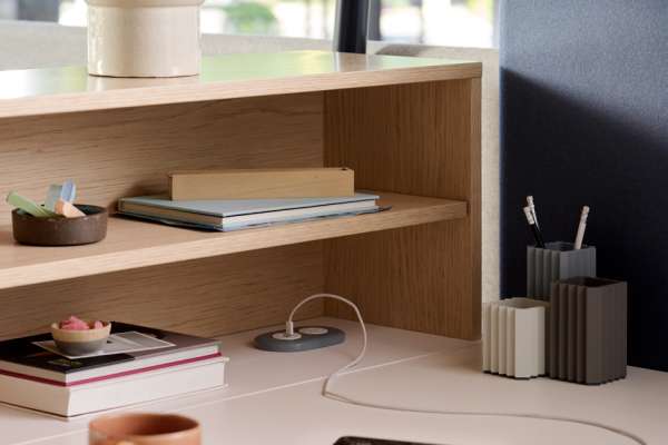 Kaleid workstation by OFS featuring integrated power and layered shelving
