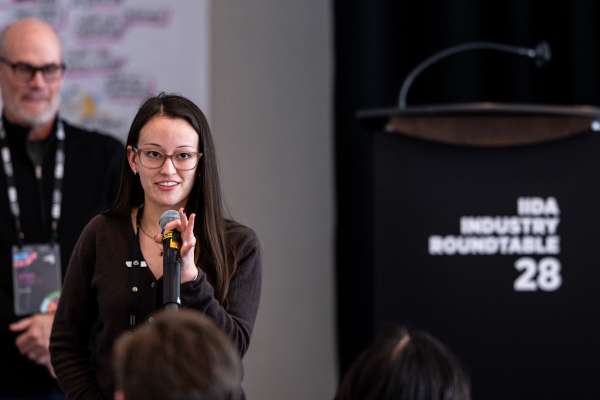 Speaker presenting at IIDA Industry Roundtable 28 on workplace design and leadership topics