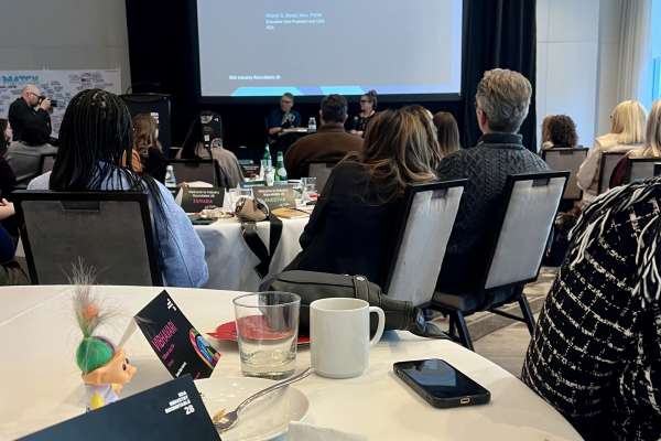 Audience listening to closing session presentation at IIDA Industry Roundtable 28 focused on design leadership and reflection
