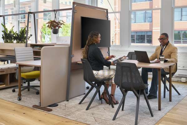 People talking sitting at Kaleid in Noho move chairs