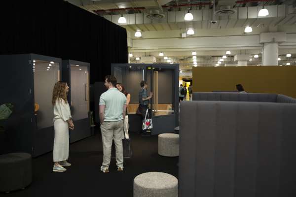 Group of people exploring ROOM booth at ICFF 2026.