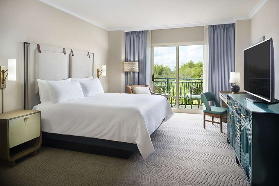 Omni Orlando Resort at ChampionsGate hotel guest rooms and suite bedroom custom furniture and casegoods