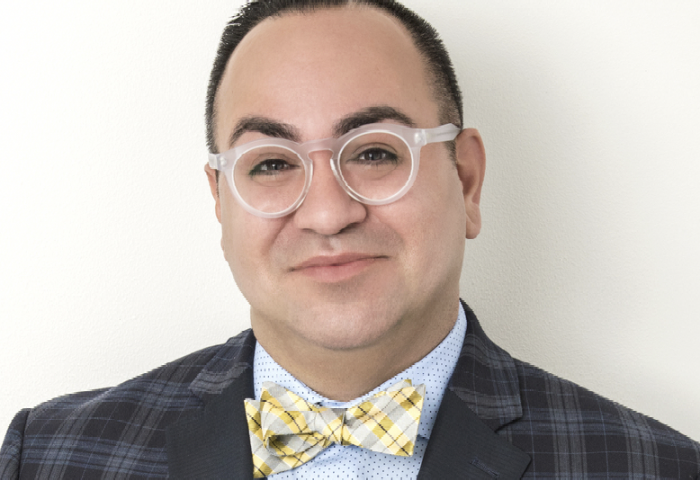 headshot of dr manny hernandez an er docotor turned designer