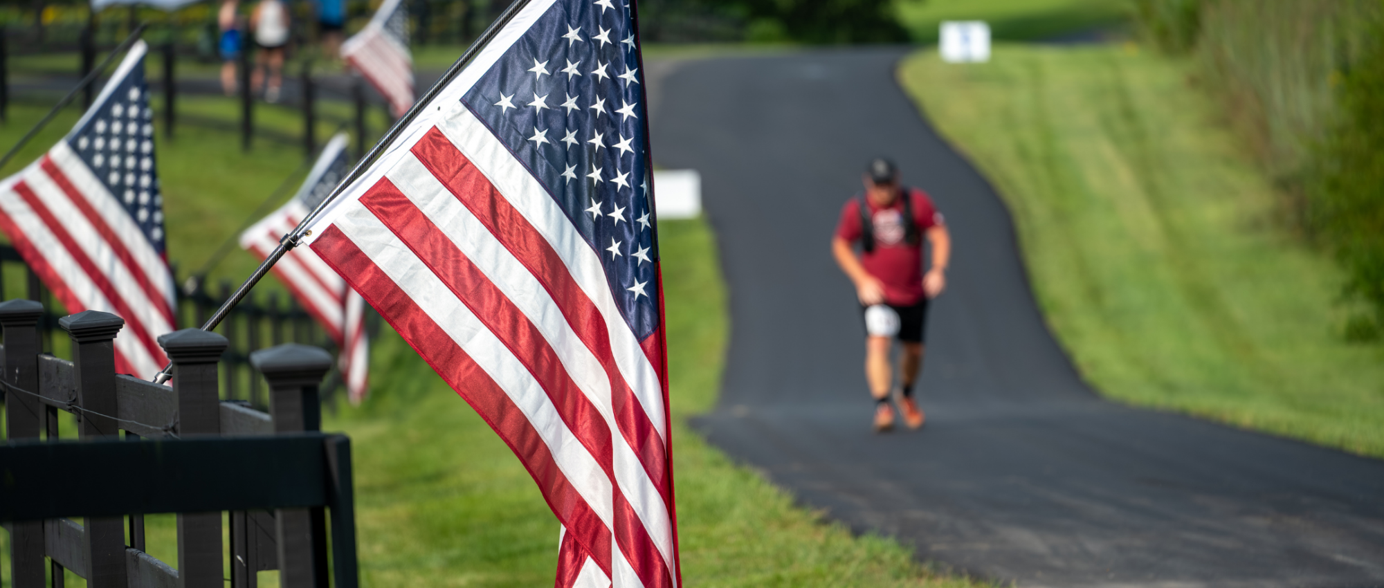 american-flag-with-runner-for-honor-and-remember-run