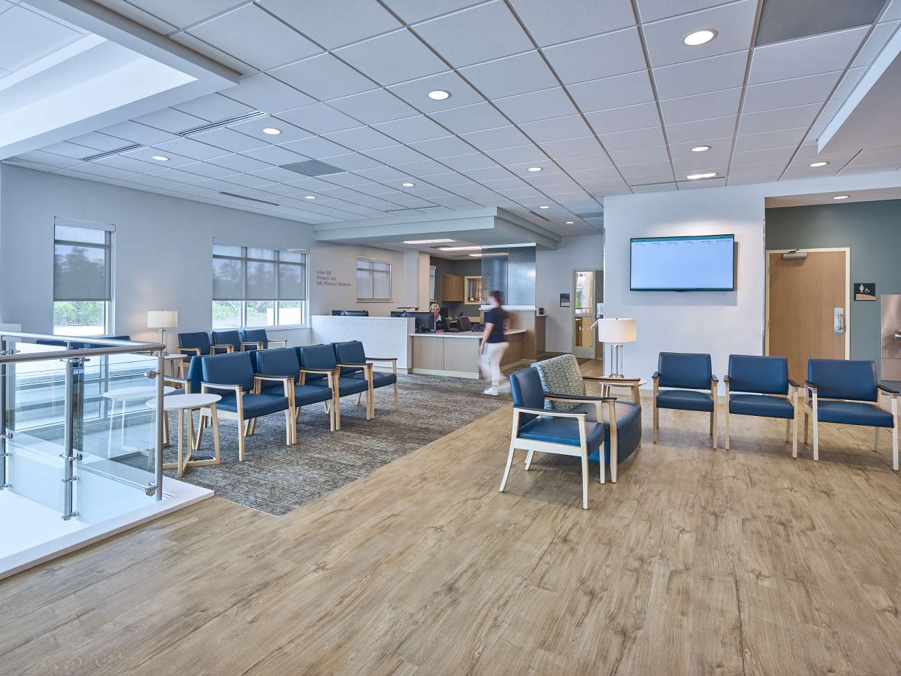 Urgent care waiting room with rows of chairs