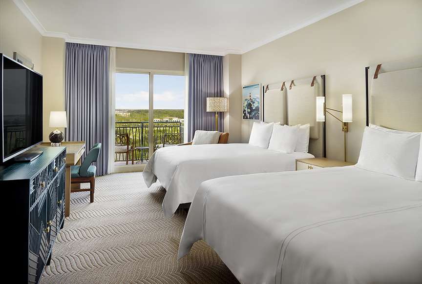 Omni Orlando Resort at ChampionsGate hotel guest rooms and suite bedroom custom furniture and casegoods
