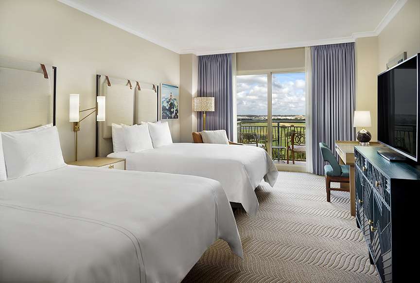 Omni Orlando Resort at ChampionsGate hotel guest rooms and suite bedroom custom furniture and casegoods