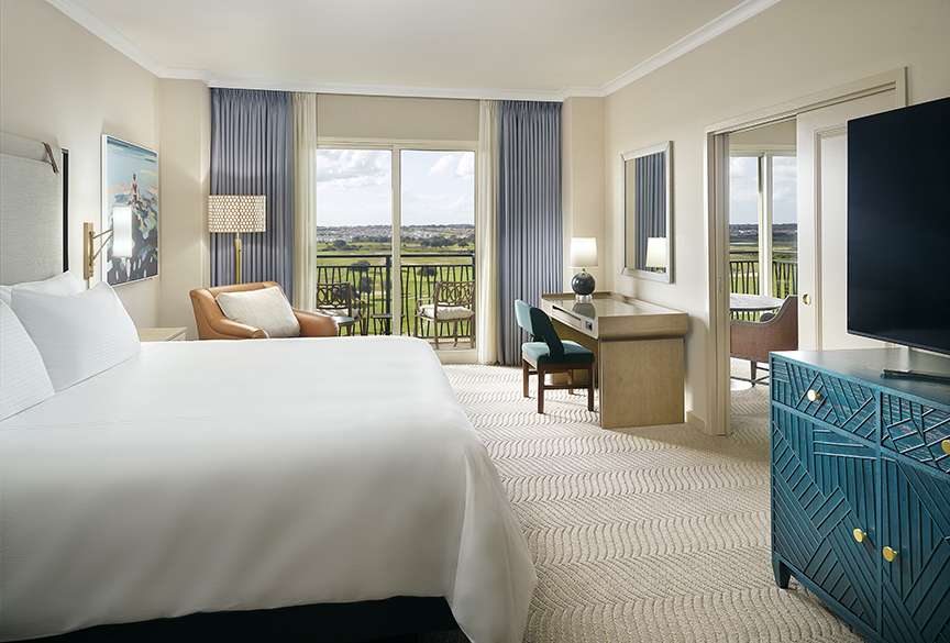 Omni Orlando Resort at ChampionsGate hotel guest rooms and suite bedroom custom furniture and casegoods
