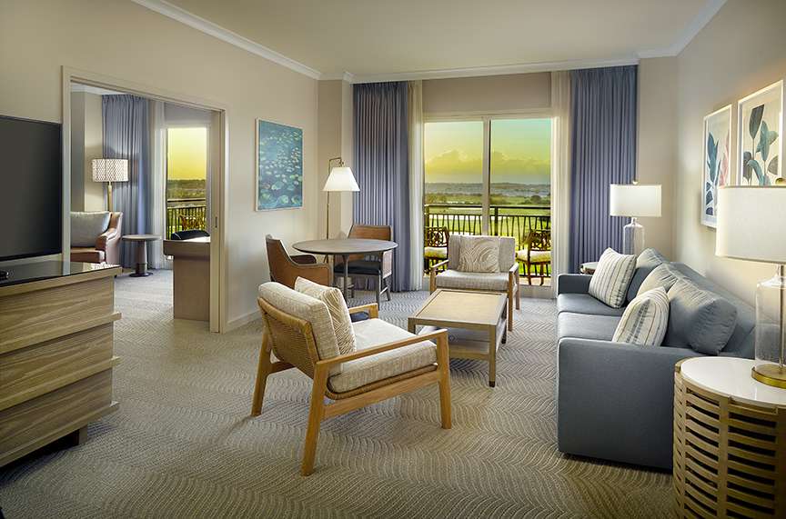 Omni Orlando Resort at ChampionsGate hotel guest rooms and suite bedroom custom furniture and casegoods