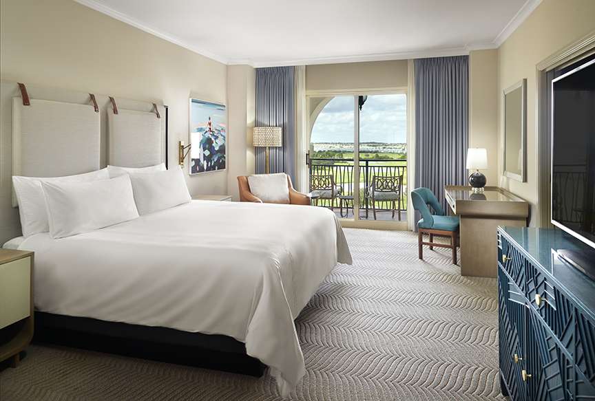 Omni Orlando Resort at ChampionsGate hotel guest rooms and suite bedroom custom furniture and casegoods