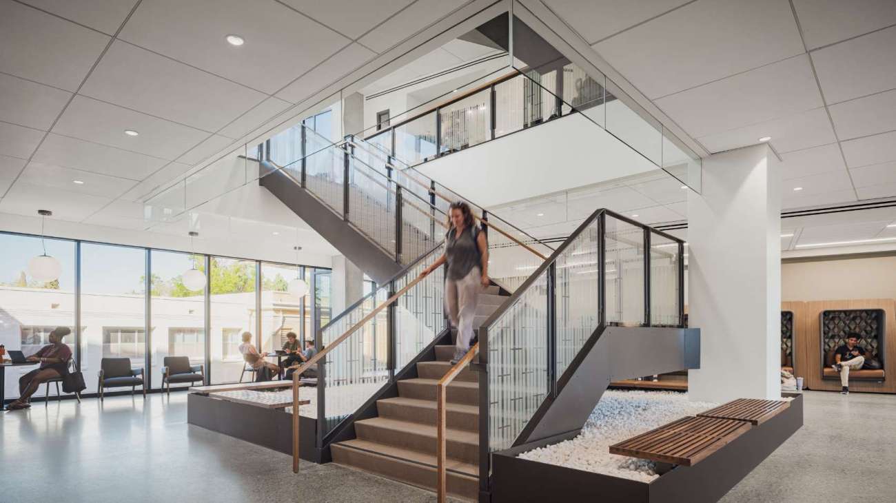 Stairs going upstairs from a study area in a university to another area