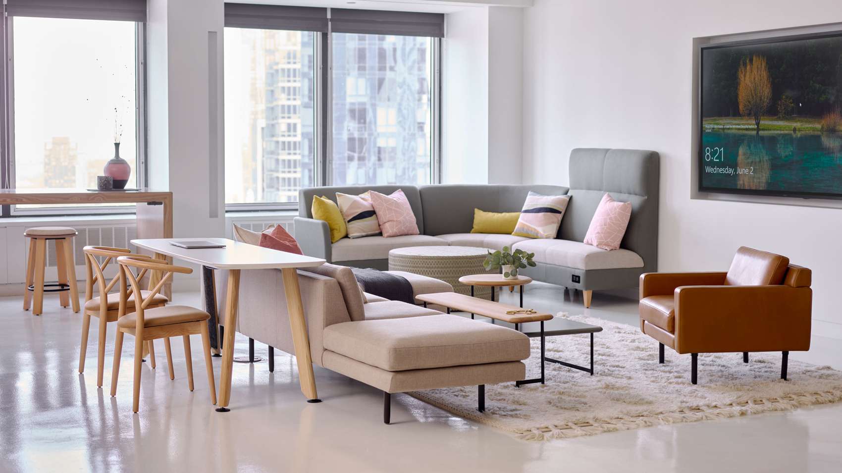 Lounge area with view of the skyline through the window