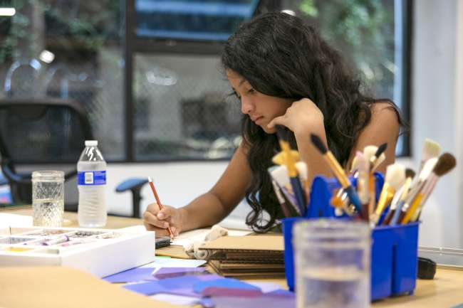 Student from Fresh Artists working on creative project