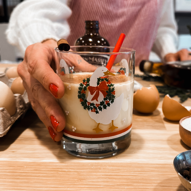 Hospitality Manager holding holiday drink